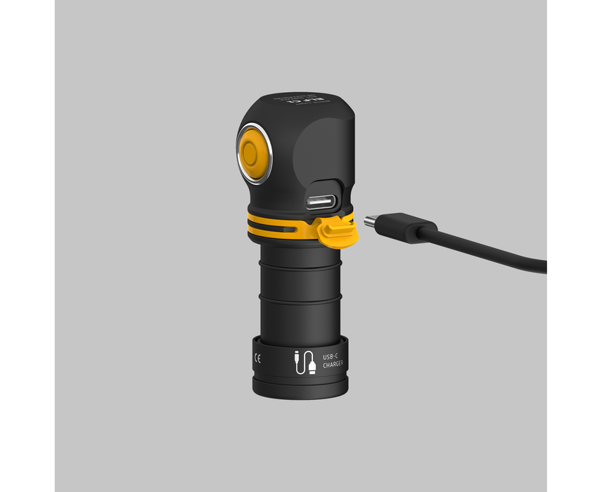 The Armytek Elf C1 USB-C White flashlight, featuring a distinctive black, L-shaped design with a yellow button, offers the convenience of a USB-C charging port connected to its cable. Delivering an impressive 1000 lumens, it ensures exceptional brightness whenever you need it.