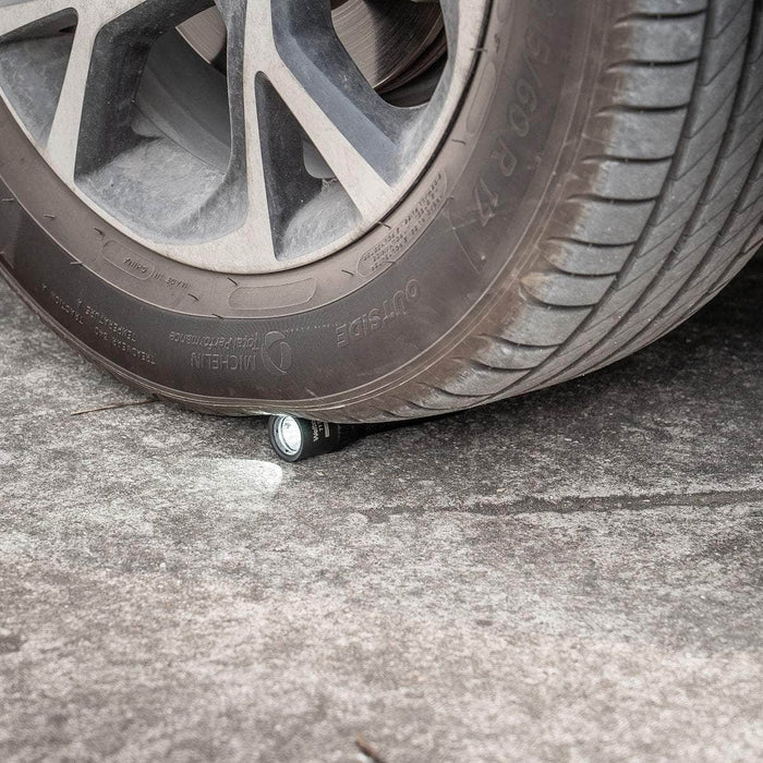 A durable car tire with the Weltool T17 attached to it.