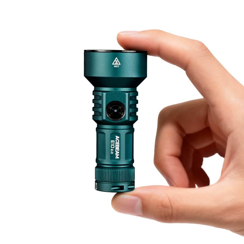 A hand holds the compact green Acebeam E10 2.0 Long-Range EDC Flashlight upright against a white background.