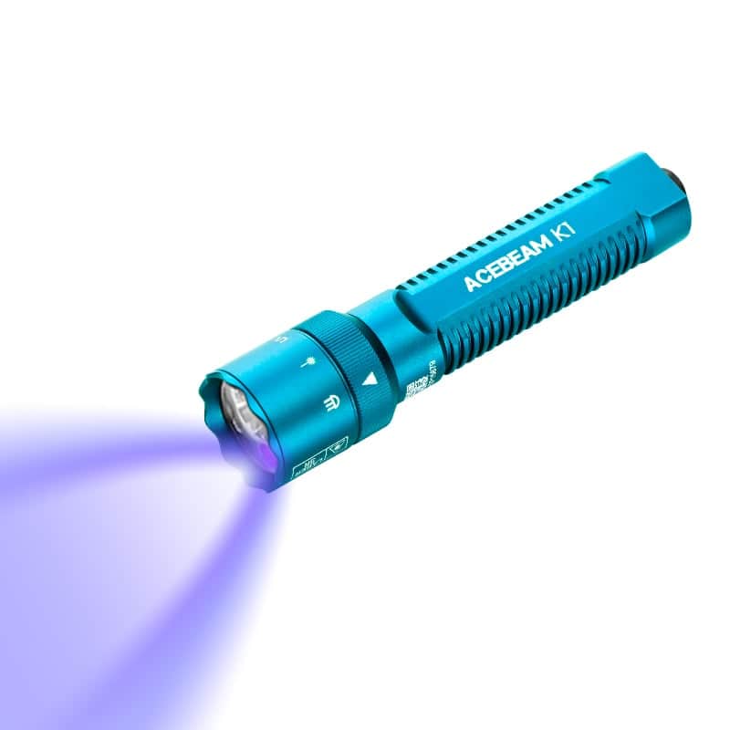 A blue Acebeam K1 EDC Flashlight, featuring three light sources, projects a vivid cyan 488nm beam against a white background.