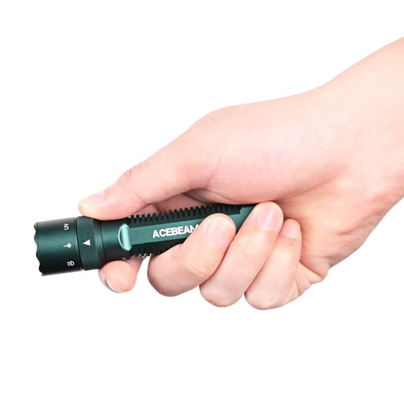 A hand holds the green Acebeam K1 EDC Flashlight with three light sources and USB-C rechargeable capability against a white background.