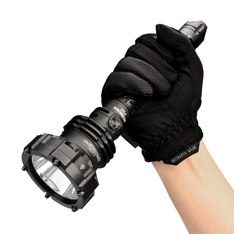 A gloved hand holding an Acebeam P20 flashlight with a rugged, tactical design, boasting 5500 lumens and an IP68 rating for ultimate durability in extreme conditions.