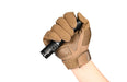 A gloved hand gripping an Acebeam T35 flashlight against a white background.