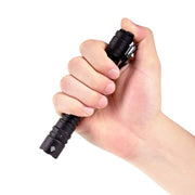A hand grips the Acebeam TAC 2AA black EDC flashlight against a white background.