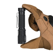 A gloved hand holds the Acebeam TAC AA 2.0, a compact black tactical EDC flashlight with a pocket clip, positioned upright against a plain white background.