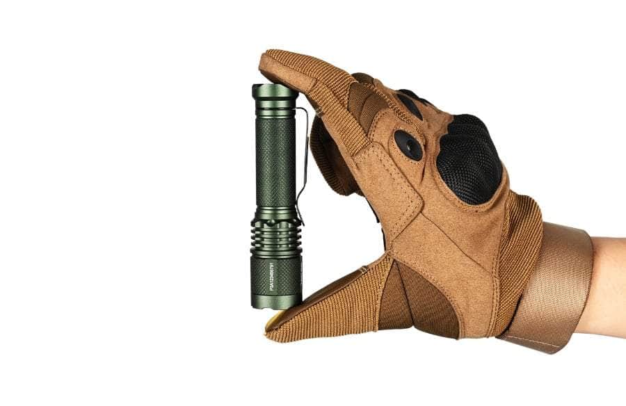 A person holding an Acebeam TAC AA flashlight in a glove.