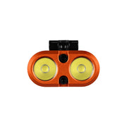 Front view of an Acebeam UC3A, an orange dual-LED rechargeable flashlight bike light featuring two yellow lenses, a black mounting bracket on top, and a central screw positioned between the lenses.