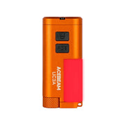 An orange Acebeam UC3A multi-color EDC light, featuring two black buttons labeled “UV” and “RGB” and a pink side clip, is displayed against a white background.