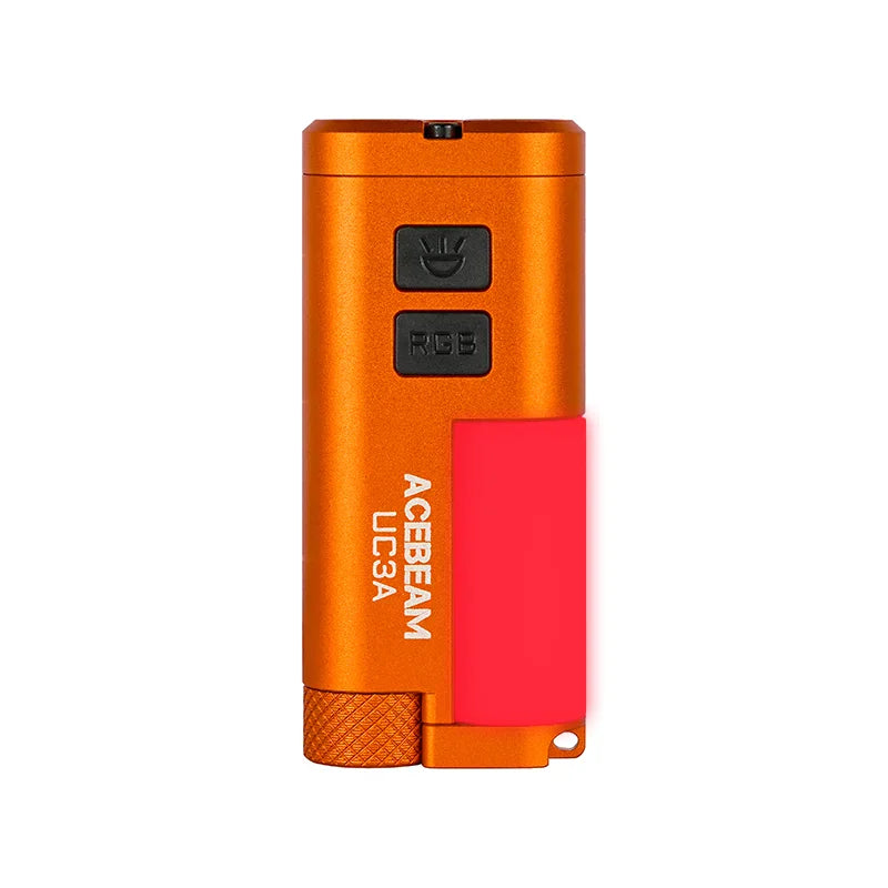 An orange Acebeam UC3A multi-color EDC light, featuring two black buttons labeled “UV” and “RGB” and a pink side clip, is displayed against a white background.