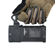 A gloved hand holds an Acebeam X35 Multi-Light Powerful Searching Flashlight battery pack by its handle, displaying product details and label on the side—an essential accessory for your rechargeable search flashlight, perfect for emergency preparedness.