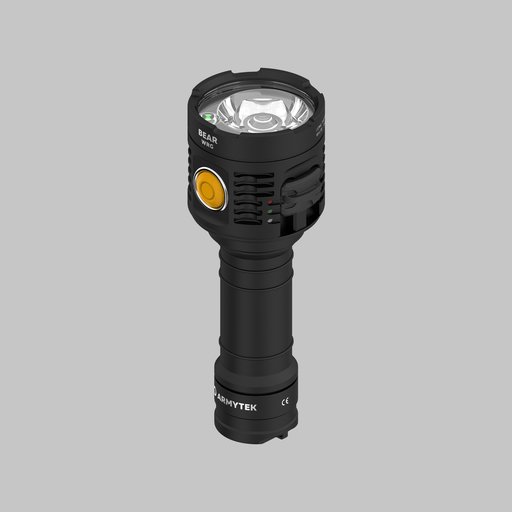 The Armytek Bear WRG is a black handheld rechargeable flashlight with a prominent yellow button and multiple cooling fins, shown standing upright on a gray background. The brand name “ARMYTEK” appears near the base. This long-range flashlight offers versatile red and green light modes for use in various environments.