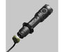 A black Armytek Dobermann Pro Max tactical flashlight with a detachable end cap and cable is shown on a plain grey background.