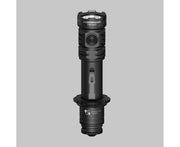 The Armytek Dobermann Pro Max tactical flashlight stands upright on a gray surface, highlighting its side switch and labeled magnetic USB charging port.