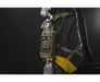 A rugged survival kit and the Armytek Predator Pro Max tactical flashlight are attached to the side of a gray and yellow backpack, set against a dark background.
