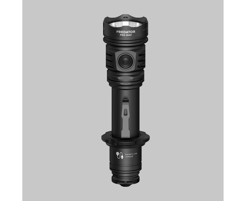 An Armytek Predator Pro Max tactical flashlight in black, featuring a central power button and magnetic USB charging port, is displayed on a plain gray background.