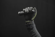 A hand holding the Armytek Viking Pro Max Magnet USB - White flashlight, which features convenient magnetic USB charging.