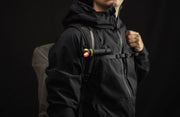 Elf C2 Max WR clipped horizontally to a backpack strap with red light on