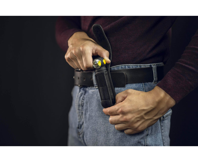 A warm man wearing an Armytek Wizard C2 Pro Max LR - Warm with a holster on it.