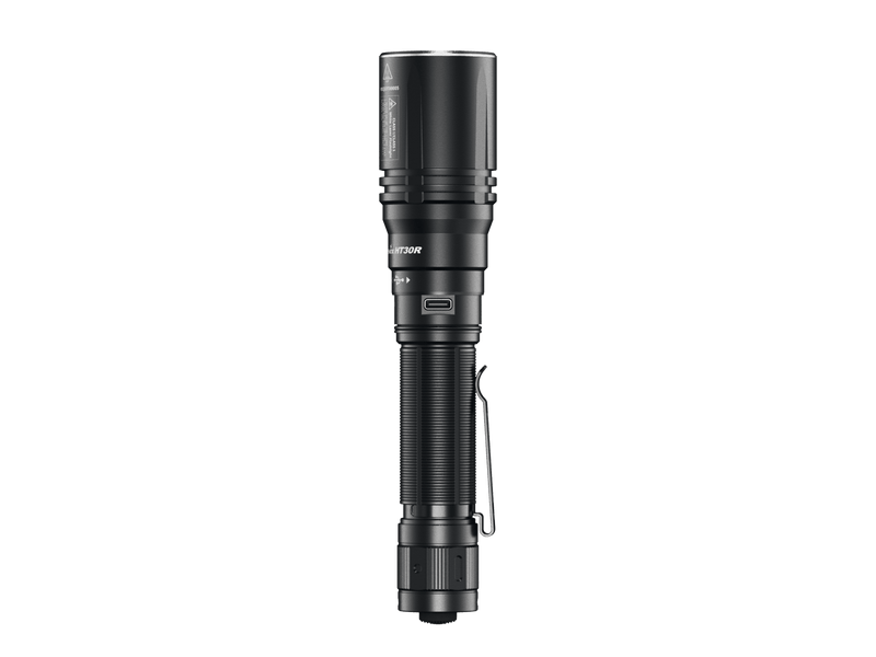 The Fenix HT30R flashlight features a ribbed handle and clip, combining precision and distance in its sleek black design. It utilizes white laser technology for enhanced visibility, making it a versatile tool when viewed from the side.
