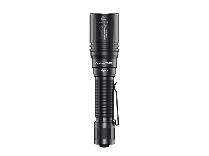 The Fenix HT30R flashlight, in black, showcases a textured grip and belt clip designed for precision distance capabilities, set against a simple white background.