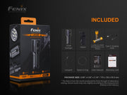 The Fenix LR35R rechargeable LED flashlight package includes the 10,000 lumens light, holster, battery, charging cable, lanyard, spare O-ring, user manual, and warranty card—all arranged beside the box.