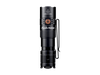 The Fenix PD25R, a black EDC flashlight featuring a clip and USB Type-C recharging capability, stands upright against a dark backdrop.