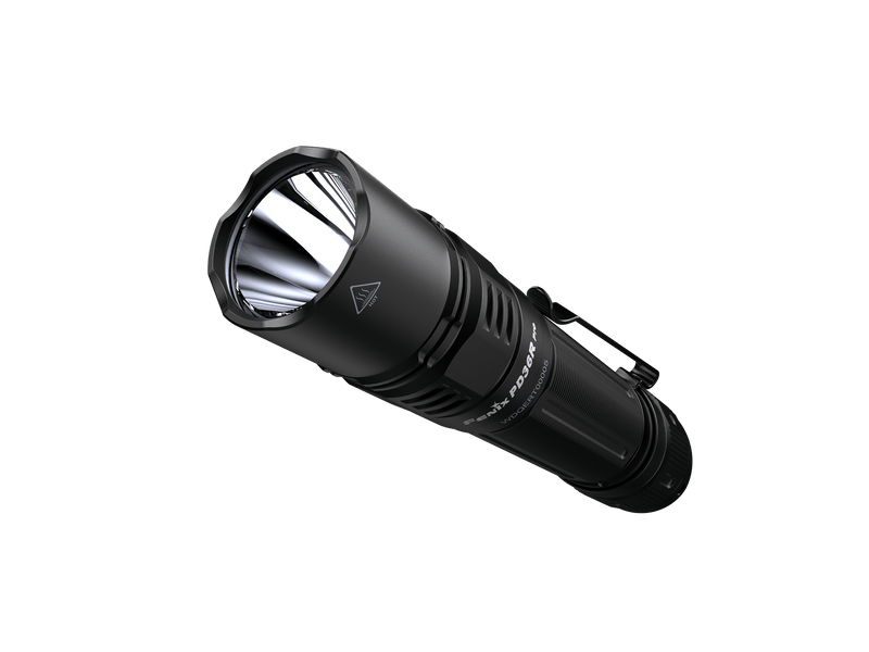 A black Fenix PD36R Pro tactical flashlight set against a dark background, captured from an angle.
