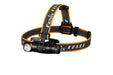 The Fenix HM61R headlamp boasts a stylish black and orange design, equipped with adjustable straps and a mounted flashlight that provides dual light sources for versatile functionality.