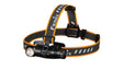 A Fenix HM61R headlamp with orange and black straps.