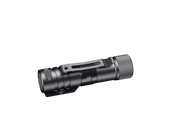 The Fenix HM71R, a compact black flashlight with a side clip, is positioned against a black background, evoking the durability and versatility characteristic of industrial applications.