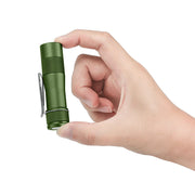 A hand holds the Lumintop FW1AA, a compact EDC flashlight with a silver pocket clip, shining 800 lumens against a white background.
