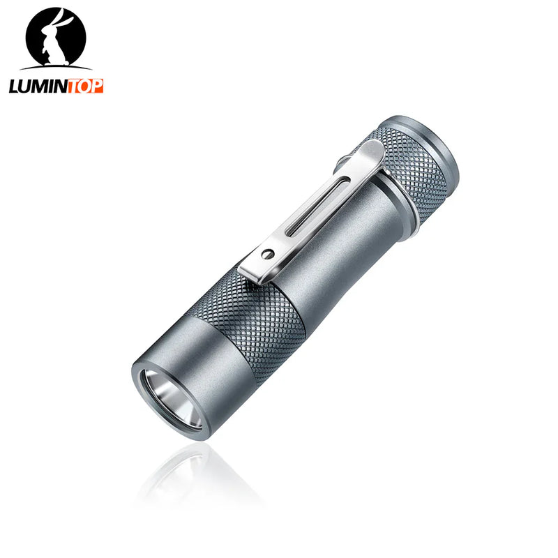 A compact, metallic Lumintop FW1AA EDC flashlight with a textured grip and pocket clip is shown on a white background with the Lumintop logo in the top left; this flashlight offers up to 800 lumens.