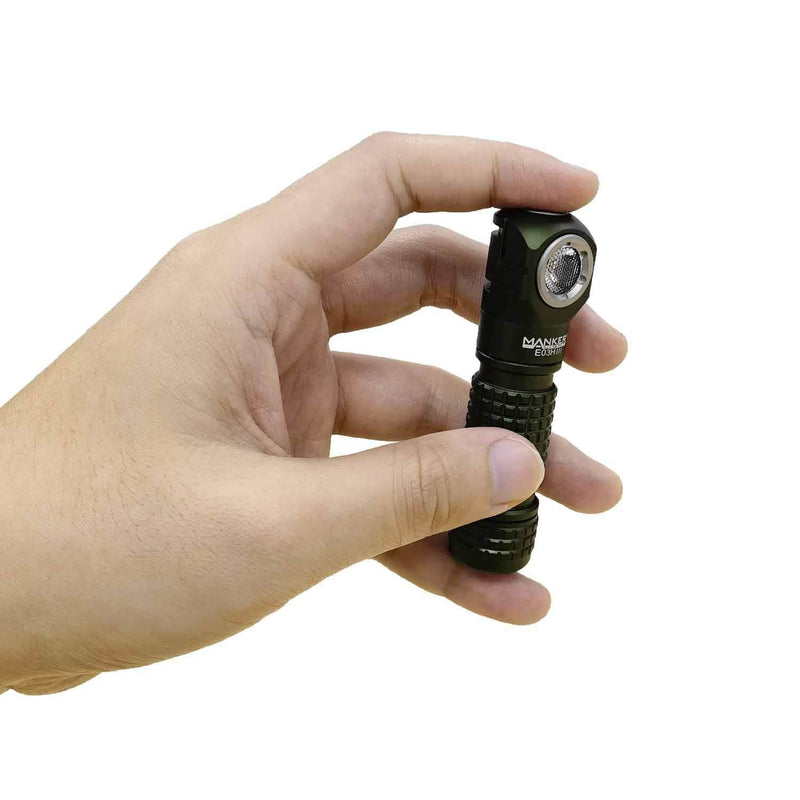 A hand holding the Manker E03H III, a small, black, premium everyday carry angle flashlight with a textured grip and compact design.