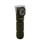 A green Manker E03H III flashlight, featuring a knurled grip and an angled head, emitting up to 1200 Lumens, is standing upright.