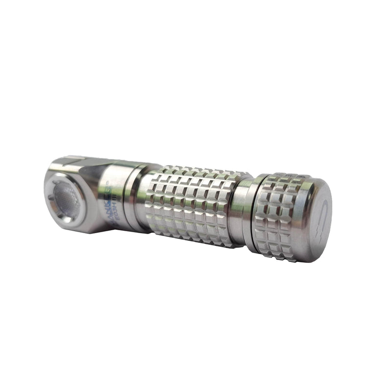 The Manker E03H III - Titanium is a compact, silver titanium flashlight with 1200 lumens, a textured grip, side button switch, and cylindrical body—perfect for everyday carry.