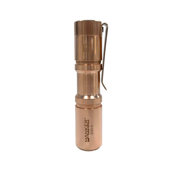 The Manker E05 II - Copper is a compact flashlight with a metal body and handle, offering versatility in its use.