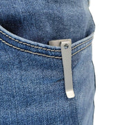A Manker E05 II Ti - Beadblasted titanium flashlight is clipped to the front pocket of blue denim jeans with its metal clip.