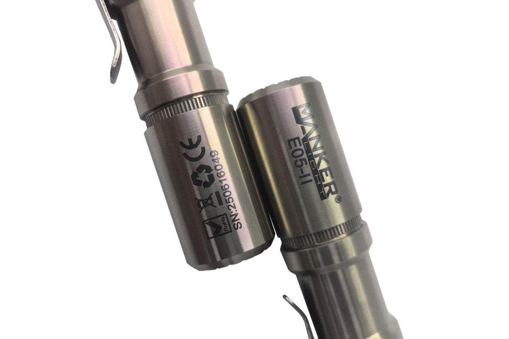Close-up of two Manker E05 II - TI Raw titanium flashlights, ideal for everyday carry; product codes and certification symbols are visible.