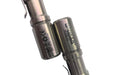 Close-up of two Manker E05 II - TI Raw titanium flashlights, ideal for everyday carry; product codes and certification symbols are visible.