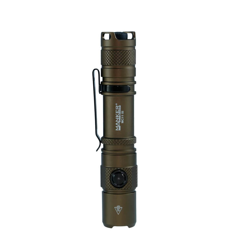 A bronze Manker MC11 III USB-C rechargeable tactical flashlight with side button, pocket clip, and textured grip stands upright on a white background.