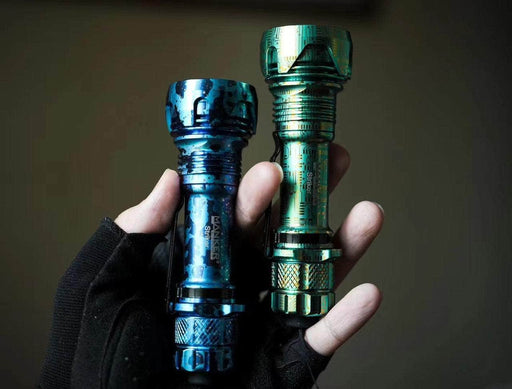 A person holding a Manker Striker Limited Edition flashlight.