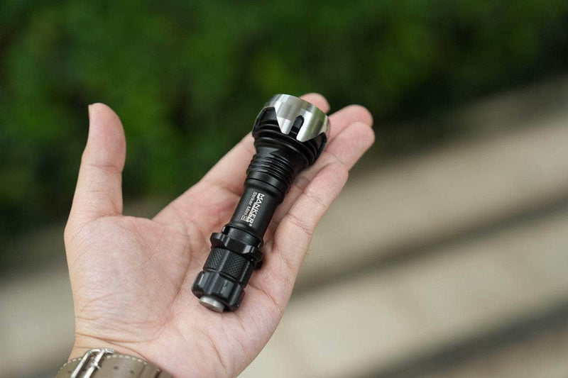 A person holding a Manker Striker Mini in their hand.