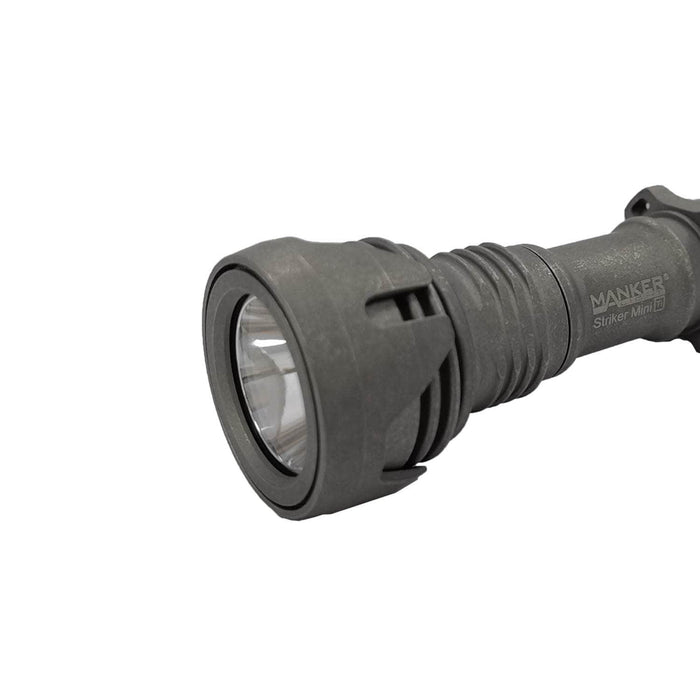 A Manker Striker Mini Titanium EDC Flashlight on a white background.