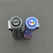 Two flashlights viewed from above on a gray background: one is classic metallic gray titanium, and the other is a ReyLight Anodized Ti LANapple with a multicolored speckled design. Both feature XPL HI 6000K LEDs for superior illumination.