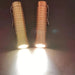 Two ReyLight Dawn - Brass flashlights on a dark surface.