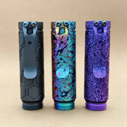 Three ReyLight Dawn Hex - Ti Anodized flashlights with Nichia 519a LEDs stand upright on a plain tan background, each displaying distinct textured and colored finishes.