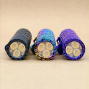 Three compact LED flashlights, including the ReyLight Dawn Hex - Ti Anodized with a Nichia 519a LED, are displayed side by side on a neutral background, showing their front lens and emitters.