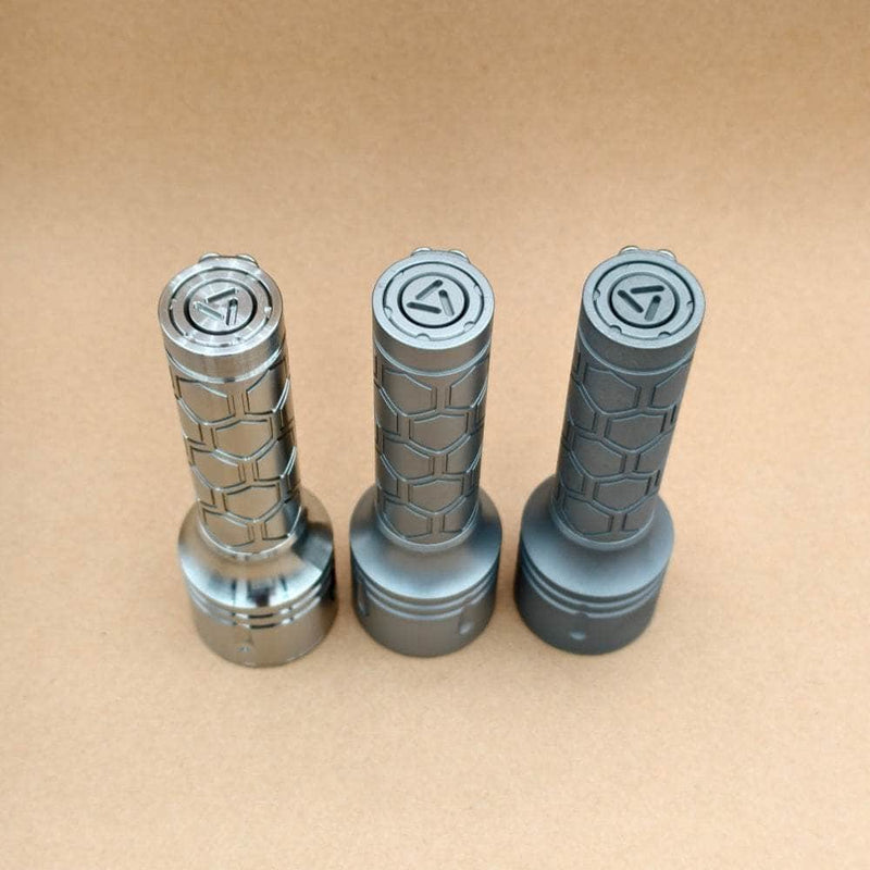 Angled view of ReyLight Dawn Max titanium tail switches in three finishes