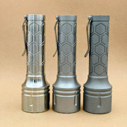 Side view of three ReyLight Dawn Max long-body flashlights with hexagonal machining