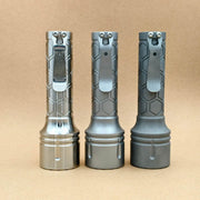 ReyLight Dawn Max 18650 titanium flashlights showing raw, beadblasted, and stonewashed finishes with pocket clips